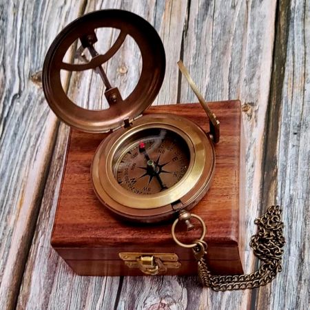 Brass Pocket Compass Displayed on Wooden Box